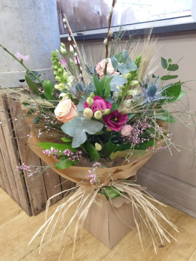 Hybrid bouquet - A bouquet with mixed fresh and dried flowers making a fusion bouquet.  You can then keep the dried flowers when the fresh may have died off.  Some of the fresh flowers will also dry naturally.  A bouquet that gives a little bit longer.