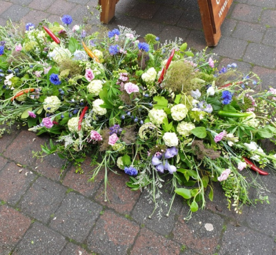 Wild stye double ended spray - A casket spray very personal to a person with a love of nature.  Moss, foliage and grasses with wilder style seasional flowers and added input from the family with items from a garden or allotment, with flowers or veg.  A completely biodegradable bas is available on request.