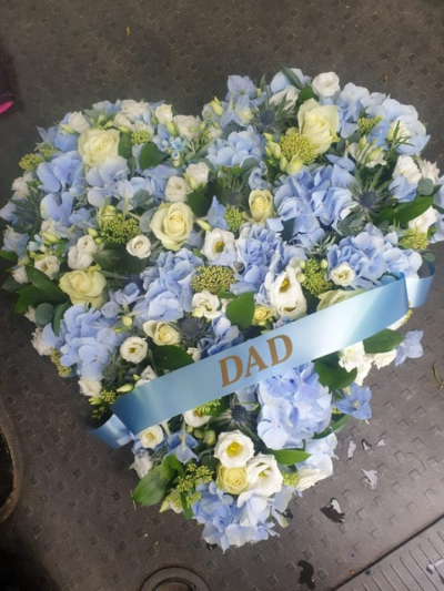 Blue heart with ribbon - A closed heart with blue and white flowers but can be altered to your requirements.  Heart sizes range from 16" to 24" when complete.